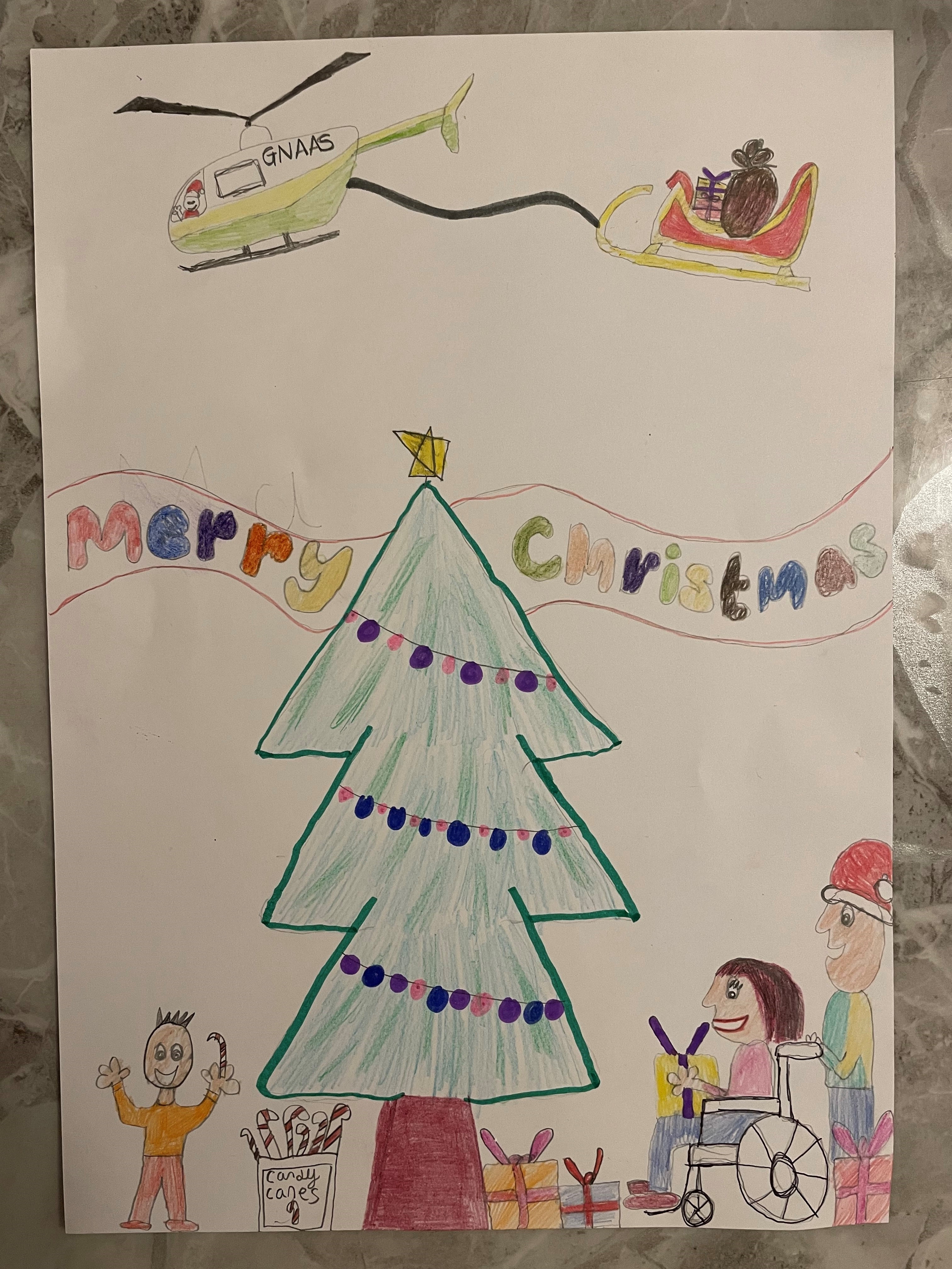 Ava Pearson's Christmas card entry. It features a Christmas tree, a sleigh and someone in a wheelchair.