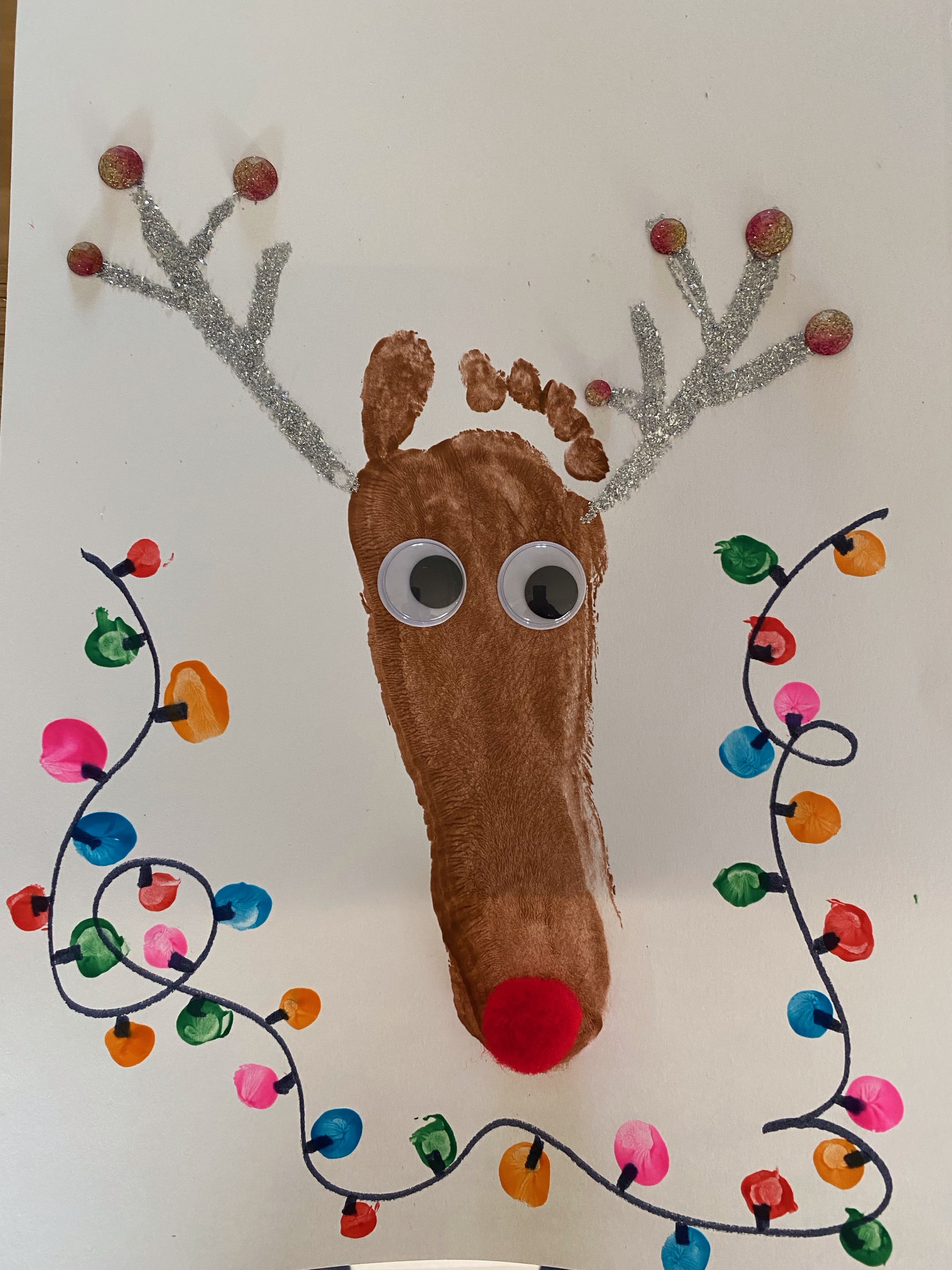 Chloe Ramhit's Christmas card entry. It features a reindeer made from a footprint.